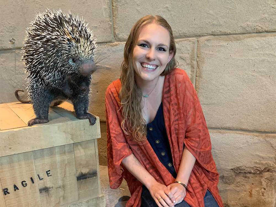 Person posing with porcupine