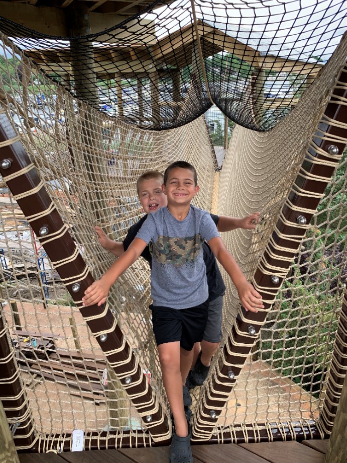 Boys Climb Rope Brigde